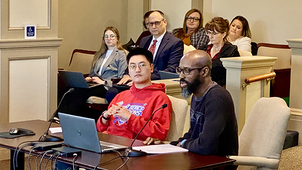 man with disabilities and his direct support professional testify before legislators 