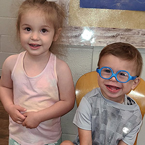 Gavin smiling with his friend and classmate Clara