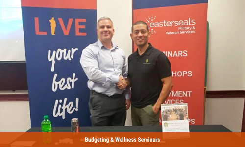 Adam Costello, Veterans Program Manager, stands with the leader of Primal Platoon during a wellness seminar