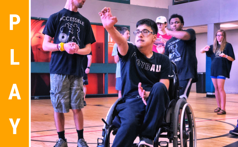 adolescent in wheel chair doing martial arts hand strike