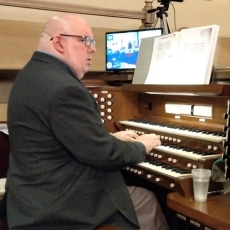 Scott plays the organ in a church