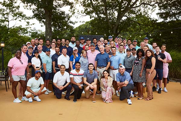 Image: large group of more than 60 golfers in group photo from Easterseals New York's 2022 golf tournament