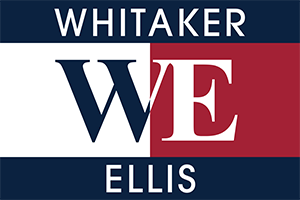 A logo that reads "Whitaker WE Ellis" from top to bottom. There is a top stripe of blue, two blocks of white and red in the center split evenly down the middle, and a stripe of blue at the bottom. 