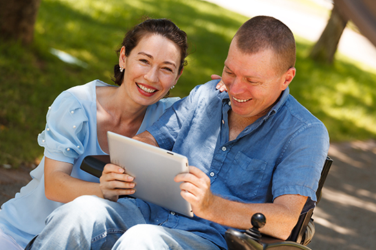 Person-centered Woman and Man Looking at iPad