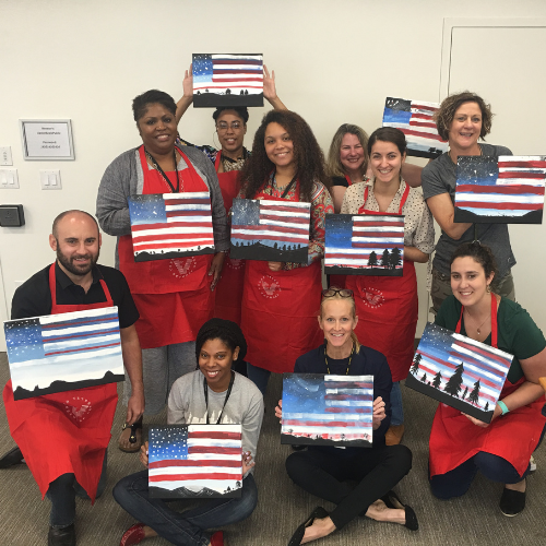 Staff and participants with their American flag paintings