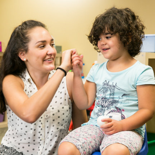 Girl in chair with teacher