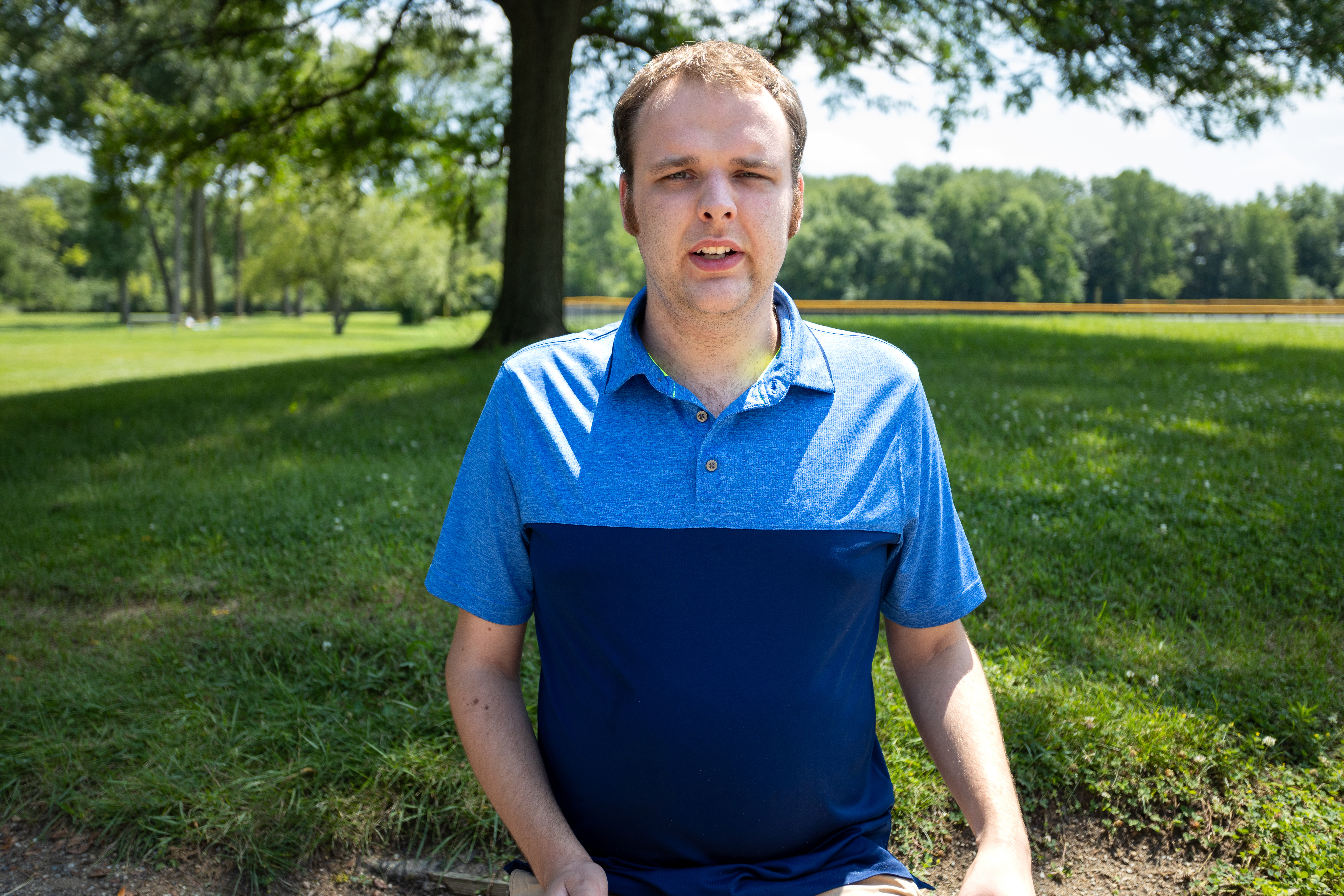 image of young adult male with a blue shirt