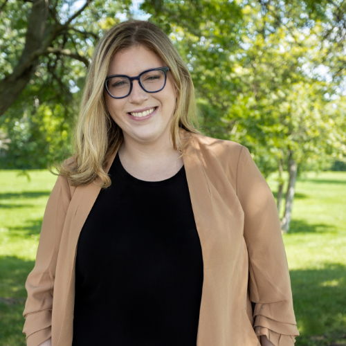 image of young adult female with blonde hair and glasses