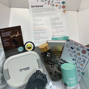 self care items, insert, and resource guide within the box