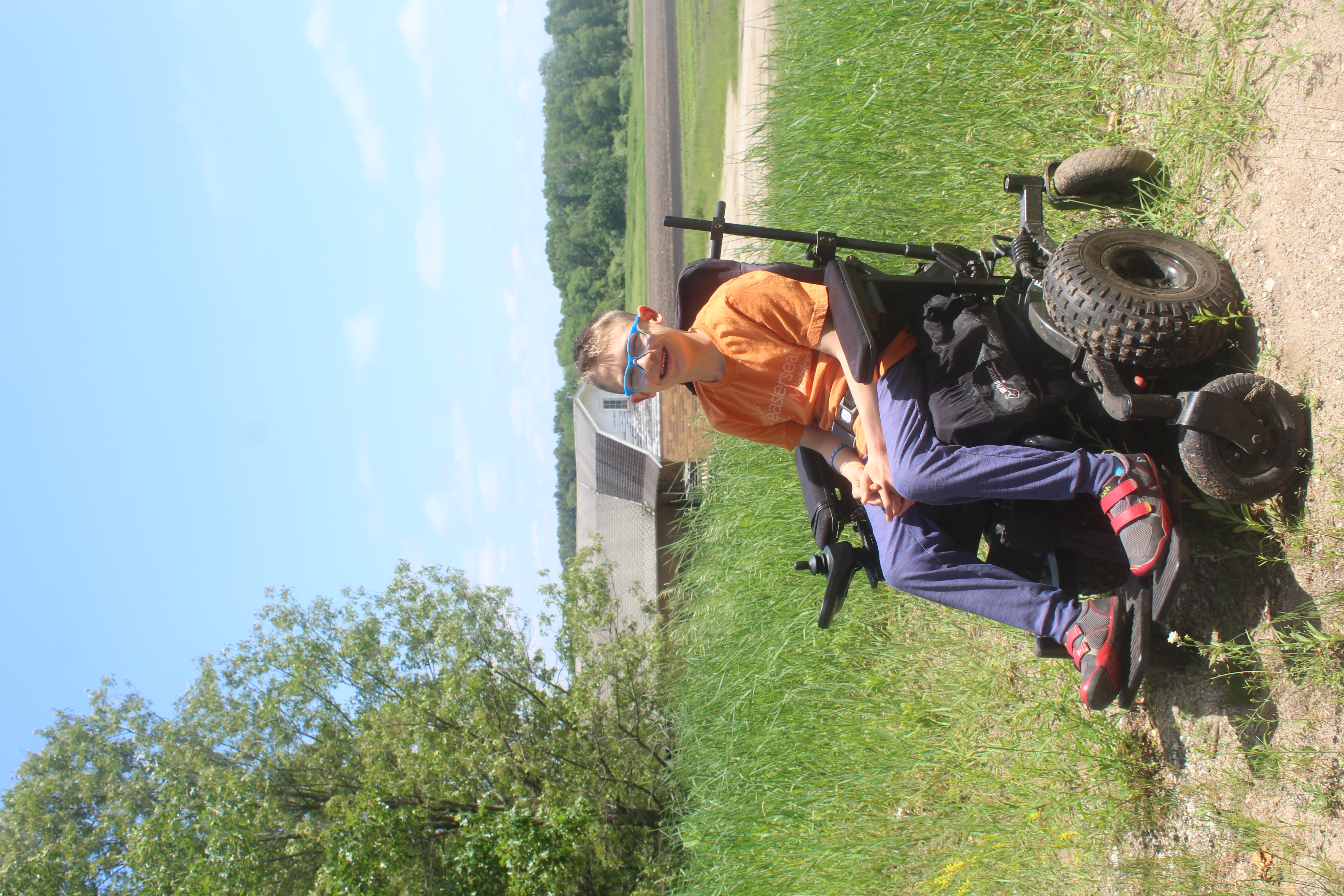 farm background, orange shirt