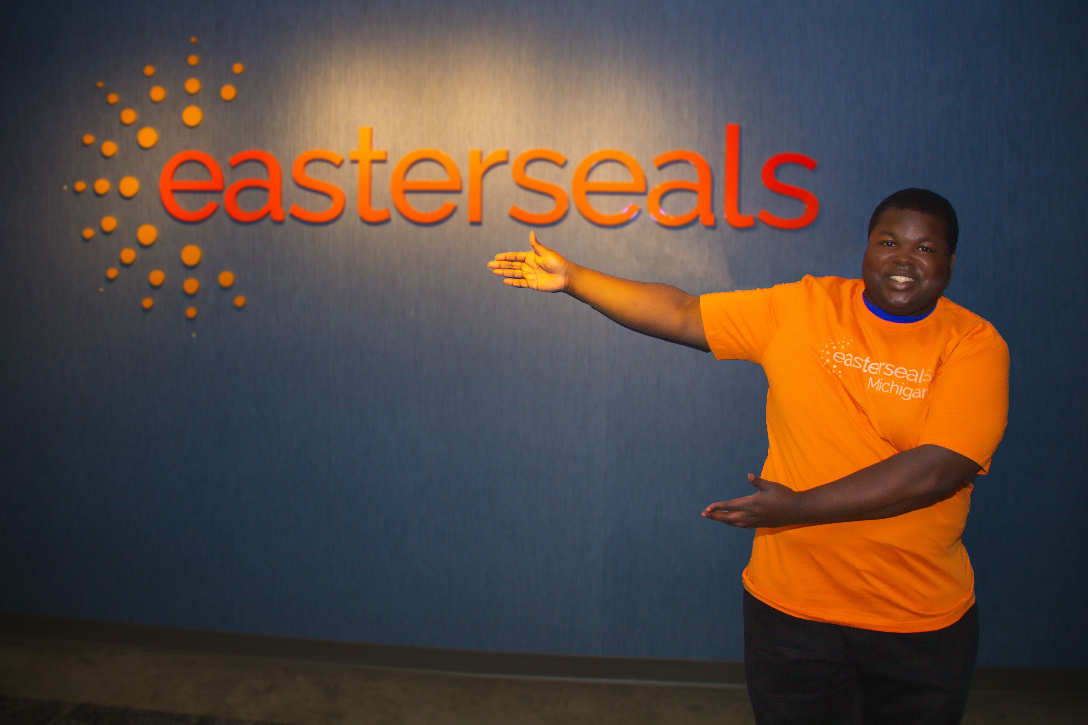 young man in Easterseal orange shirt