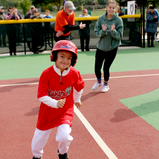 younger Johnny running bases in Lugnuts jersey