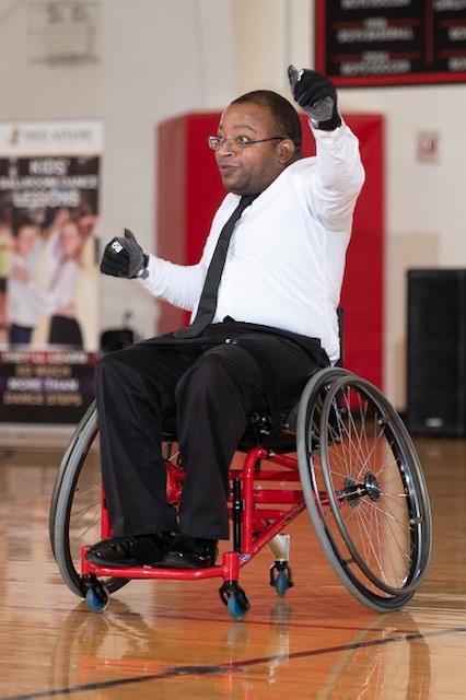 Jonathon playing wheelchair basketball