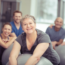 a group of people in a class using exercise balls