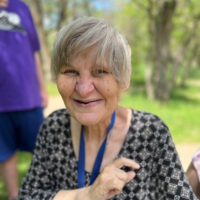 an explorers participant smiles for the camera