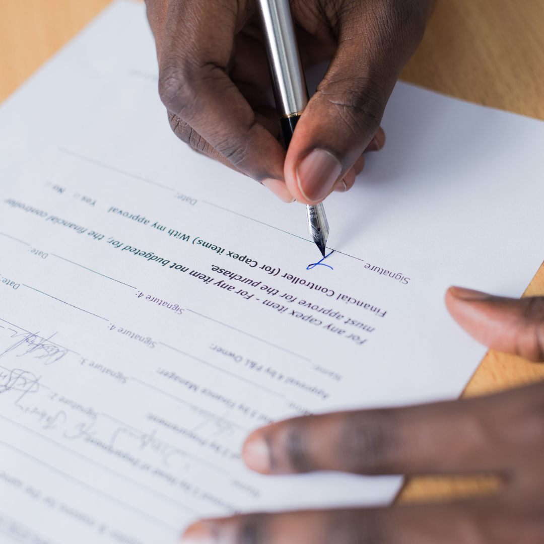 person filling out paperwork