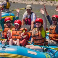 people in a raft on the river