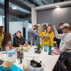 a group of people smiling and high fiving