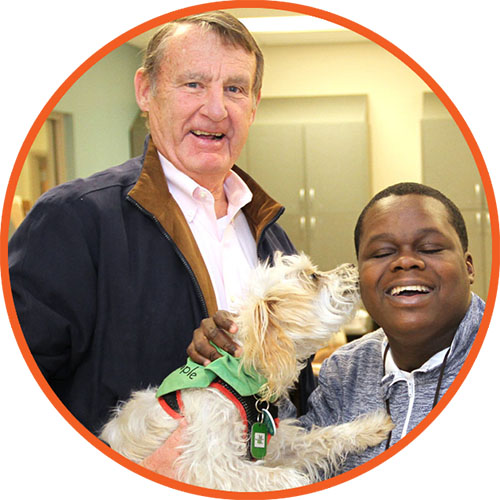 Joshua (r), who participates in Easterseals adult day program, has formed a special bond with volunteers Bill and Skipper and enjoys their weekly visits to the program.