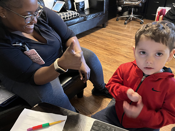 Therapist and child engaging with each other in Applied Behavior Analysis Therapy session