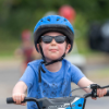Boy with sunglasses on bikes