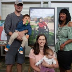 Photo exhibit family smiling and posing together 