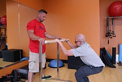 Dave working out with parallel bar