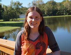 Morgan Baker standing on bridge