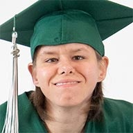 Haleigh smiling and wearing graduation cap