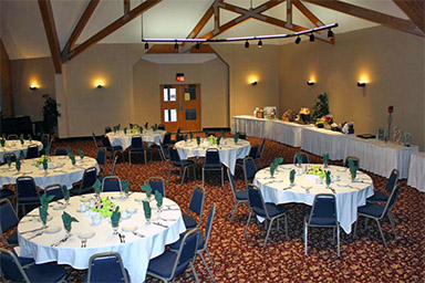 Crescent Room corporate luncheon setup with with serving tables against wall