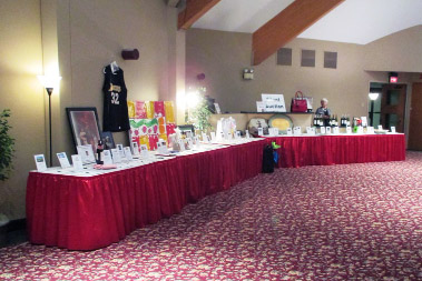 Crescent Room corporate event showing auction tables against wall