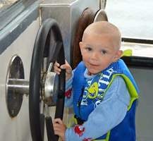 William - driving a boat