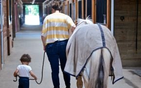 Boy and Woman leading Horse