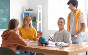 wellness group of teens sit at a table inside