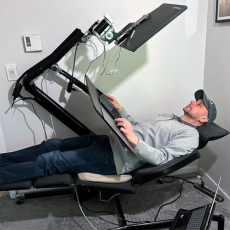 chris sitting in his AT adjusted desk and chair