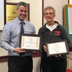 kristi and paul holding awards