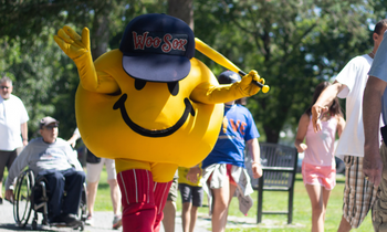 WooSox Smiley walks with the Easterseals crowd outside