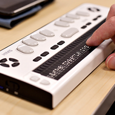 Image of fingers typing on HIMS braille note taker