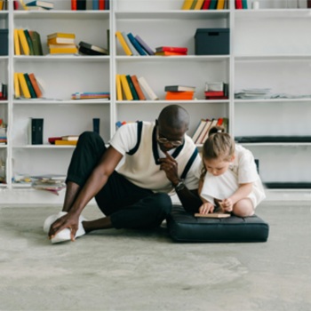 therapist with young child on floor