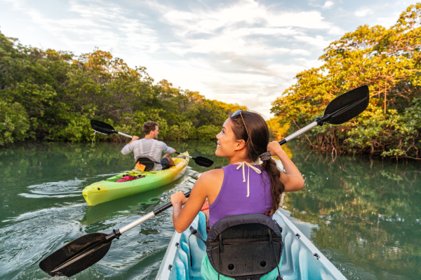 Young man and woman kayaking