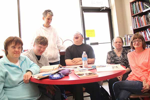 Group of people sitting at a tablwe