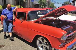 Man with car at car show