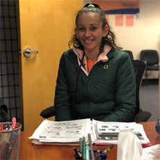 Connecting Communities participant, Esmeralda, smiling during one of our classes.