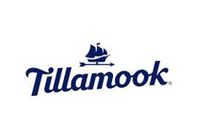 Tillamook Dairy logo - icon is a navy blue ship sailing over the top of the text that reads "Tillamook"