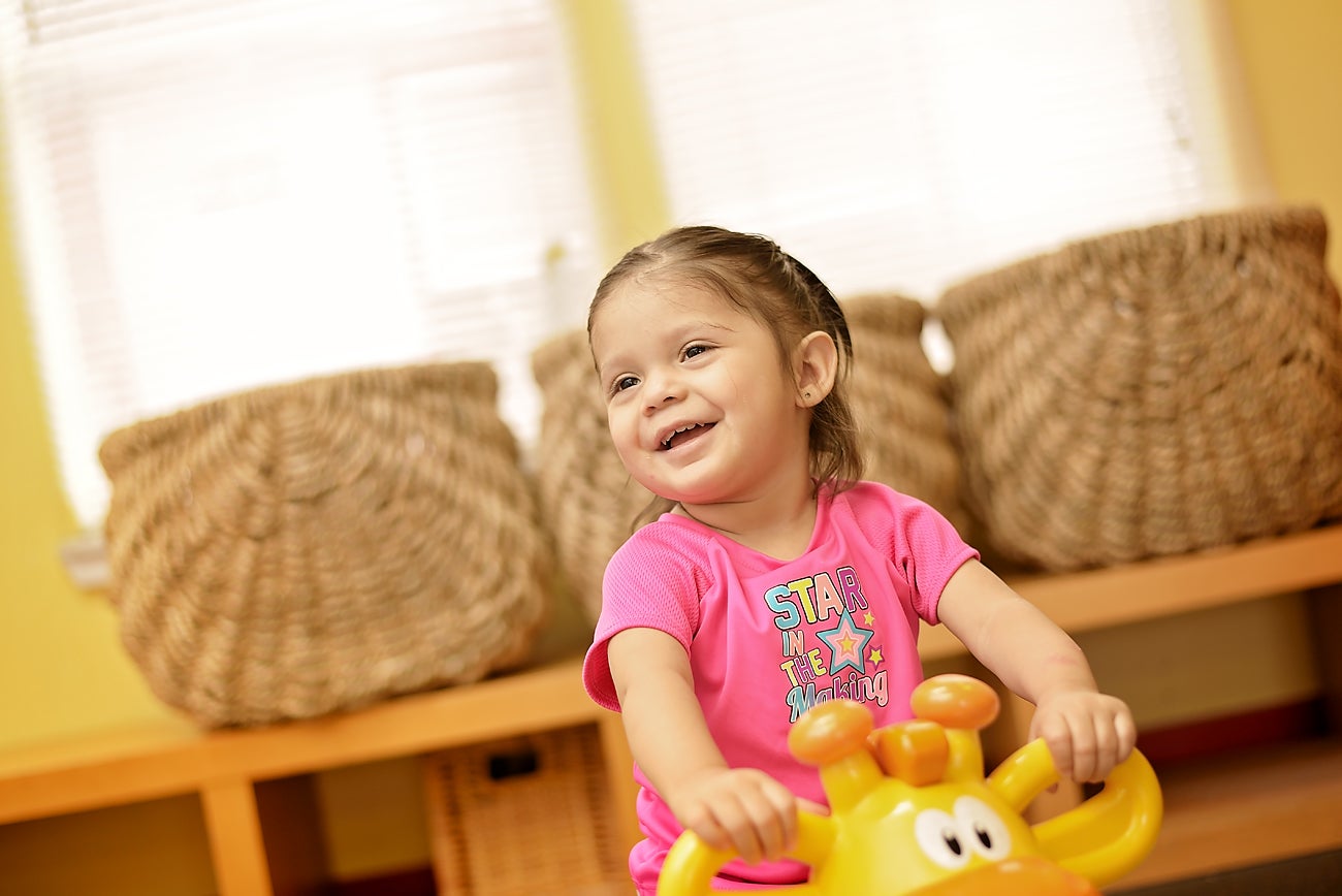 Small child playing in childcare center