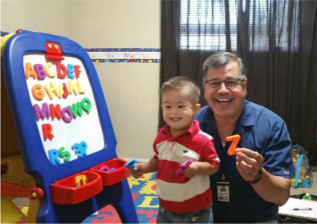 Therapist and child working on ABCs