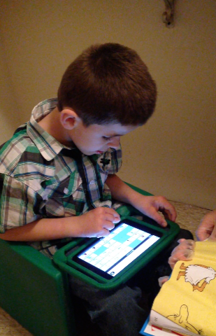 child using an iPad