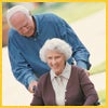 Husband and Wife walking in park