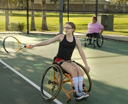 Auburn playing tennis.