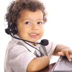 smiling toddler with a headset on